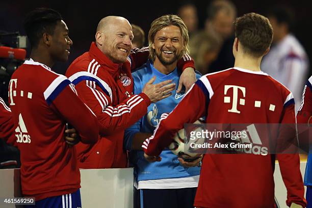 Sporting director Matthias Sammer hugs Anatolyi Tymoshchuk of Zenit during day 7 of the Bayern Muenchen training camp at ASPIRE Academy for Sports...