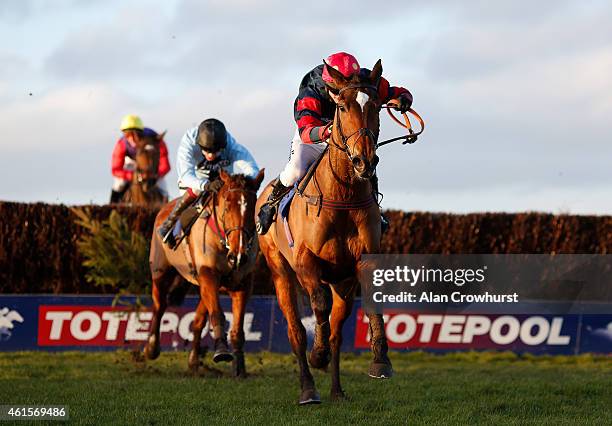Tom O'Brien riding Toowoomba clears the last to win The Higos Insurance Services Street Novices' Limited Handicap Steeple Chase at Wincanton...