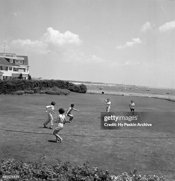 Eunice Kennedy, Jacqueline Bouvier, Edward Kennedy, John F. Kennedy and Jean Kennedy play footballl while on vacation at the Kennedy compound in June...