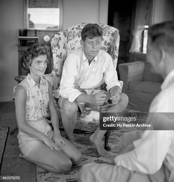 Senator John F. Kennedy and fiance Jacqueline Bouvier are interviewed for a LIFE Magazine story while on vacation at the Kennedy compound in June...