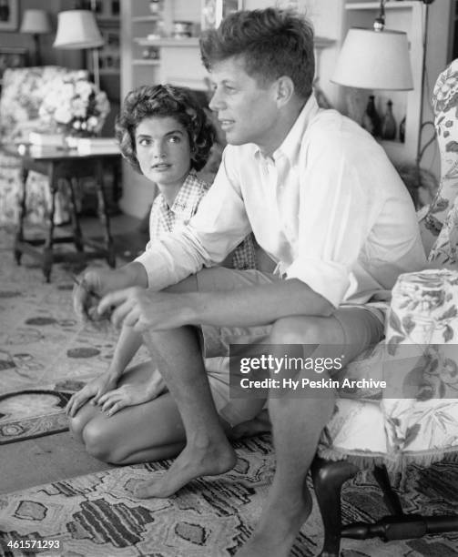 Senator John F. Kennedy and fiance Jacqueline Bouvier are interviewed for a LIFE Magazine story while on vacation at the Kennedy compound in June...