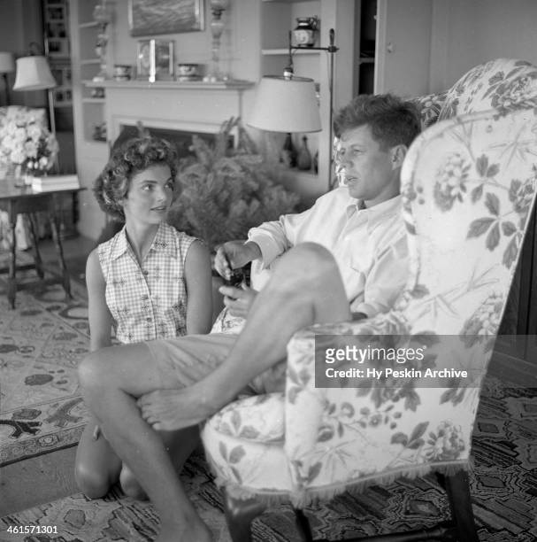 Senator John F. Kennedy and fiance Jacqueline Bouvier are interviewed for a LIFE Magazine story while on vacation at the Kennedy compound in June...