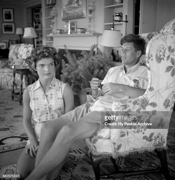 Senator John F. Kennedy and fiance Jacqueline Bouvier are interviewed for a LIFE Magazine story while on vacation at the Kennedy compound in June...