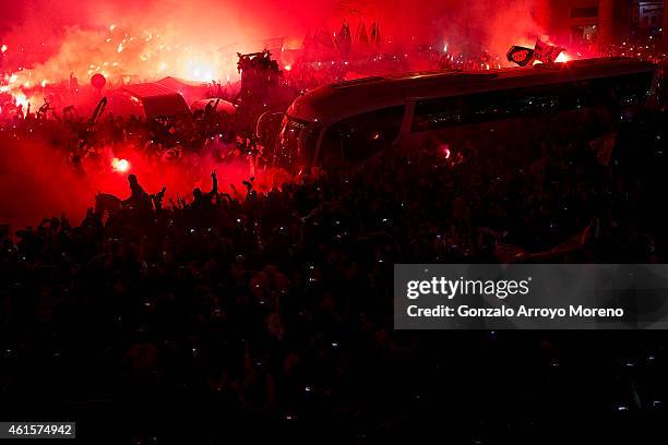 Real Madrid fans receive the bus carrying their team with flares before the Copa del Rey Round of 16 second leg match between Real Madrid CF and Club...