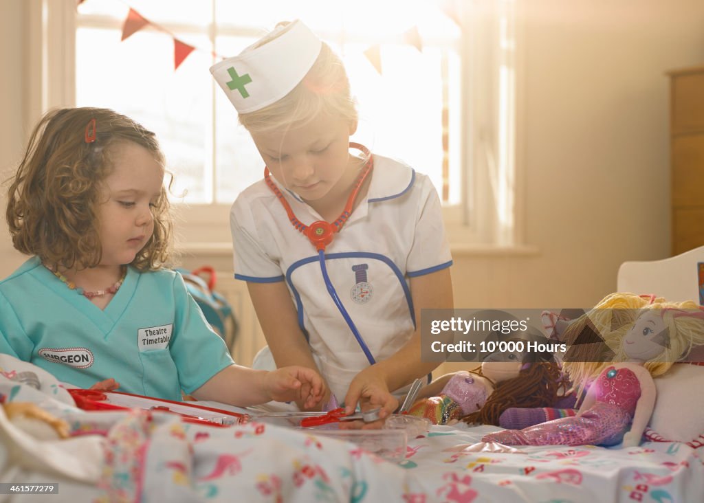 Two girls playing, dressed as doctor and nurse