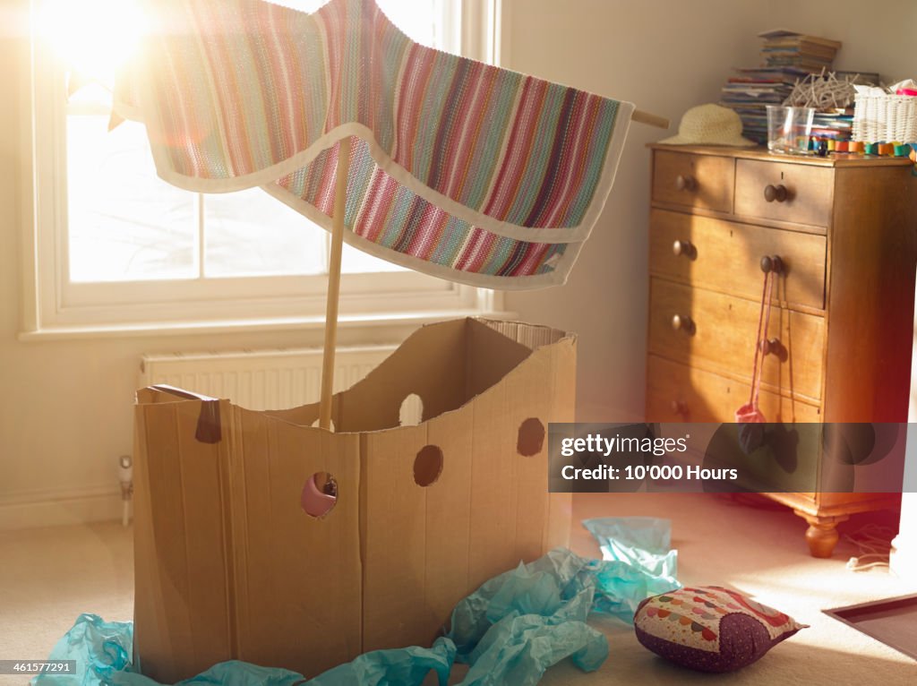 Childs room with home made cardboard boat