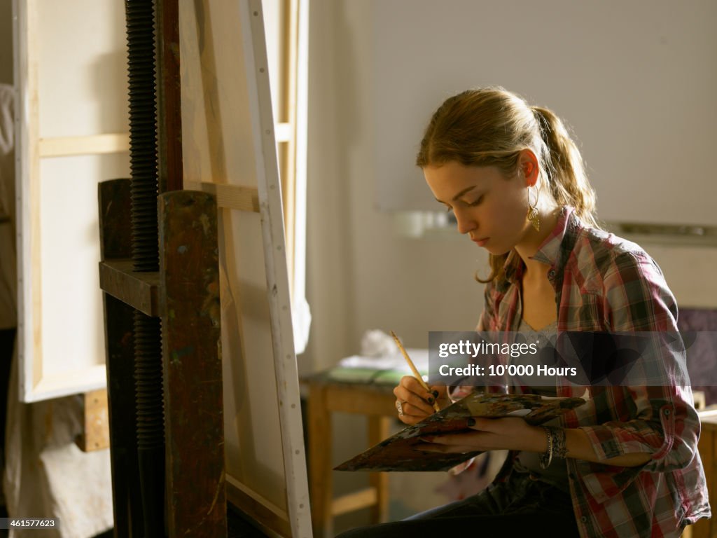 Young woman painting