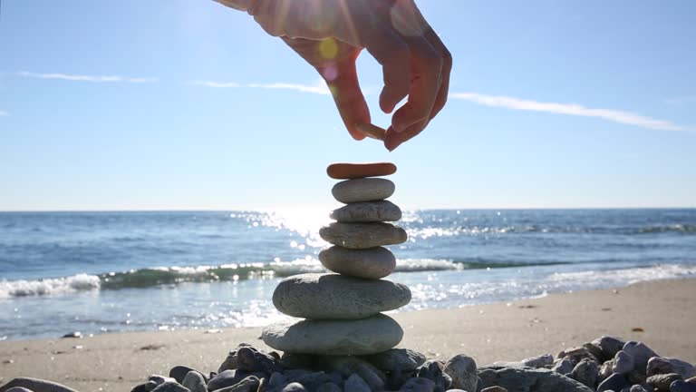 People Stacking Rocks 176 Person Stacking Rocks Stock Videos, Footage, & 4K Video Clips ...