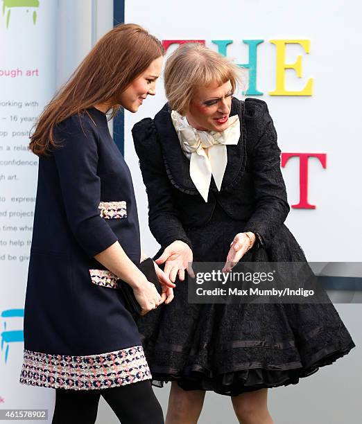 Catherine, Duchess of Cambridge, Royal Patron of The Art Room, talks with artist Grayson Perry, dressed as his female alter-ego Claire, as she...