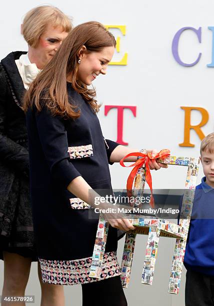 Catherine, Duchess of Cambridge, Royal Patron of The Art Room, is presented with a childs chair during a visit to the Clore Art Room at Barlby...