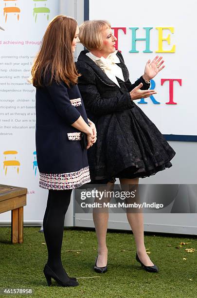 Catherine, Duchess of Cambridge, Royal Patron of The Art Room, talks with artist Grayson Perry, dressed as his female alter-ego Claire, as she...