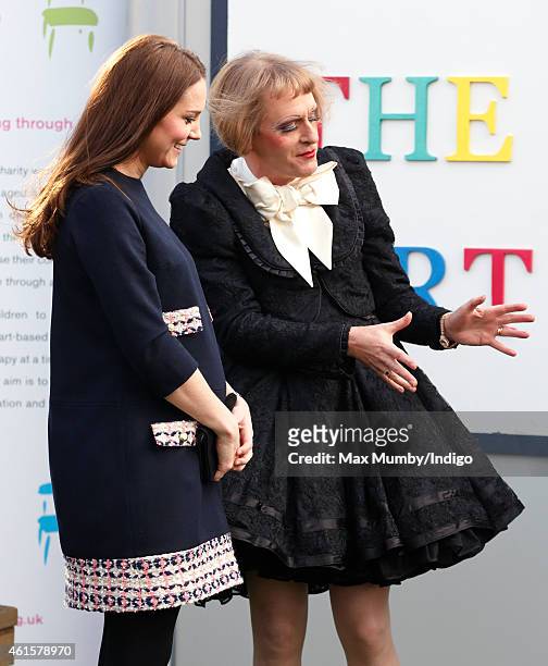 Catherine, Duchess of Cambridge, Royal Patron of The Art Room, talks with artist Grayson Perry, dressed as his female alter-ego Claire, as she...