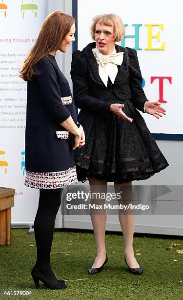 Catherine, Duchess of Cambridge, Royal Patron of The Art Room, talks with artist Grayson Perry, dressed as his female alter-ego Claire, as she...