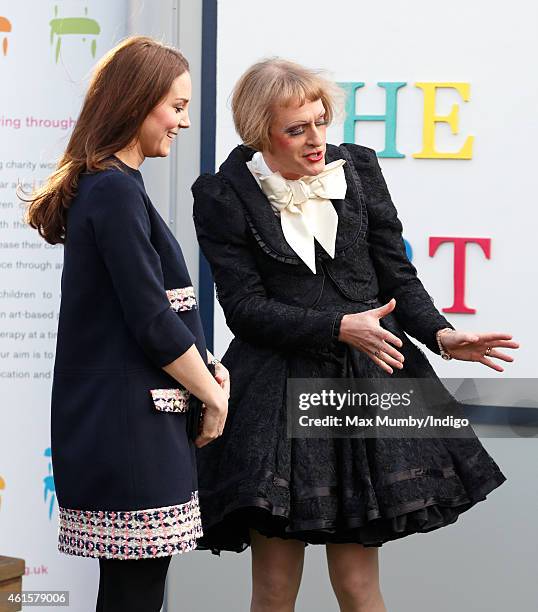 Catherine, Duchess of Cambridge, Royal Patron of The Art Room, talks with artist Grayson Perry, dressed as his female alter-ego Claire, as she...