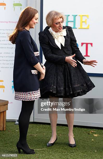 Catherine, Duchess of Cambridge, Royal Patron of The Art Room, talks with artist Grayson Perry, dressed as his female alter-ego Claire, as she...