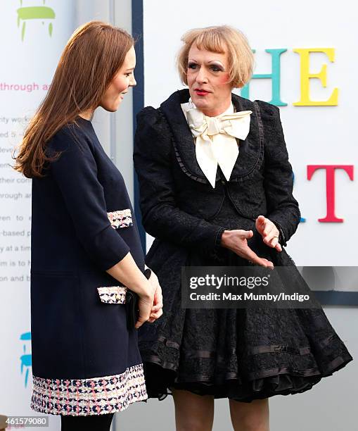 Catherine, Duchess of Cambridge, Royal Patron of The Art Room, talks with artist Grayson Perry, dressed as his female alter-ego Claire, as she...