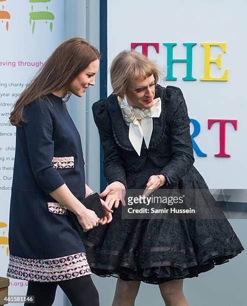 Catherine, Duchess of Cambridge is greeted by Grayson Perry as she arrives to officially open The Clore Art Room at Barlby Primary School on January...