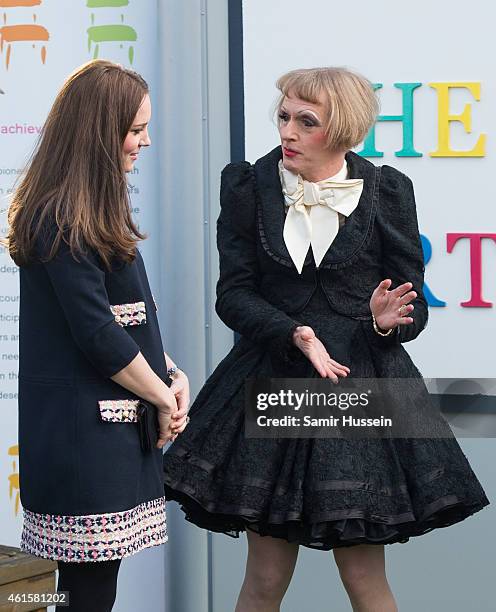 Catherine, Duchess of Cambridge is greeted by Grayson Perry as she arrives to officially open The Clore Art Room at Barlby Primary School on January...