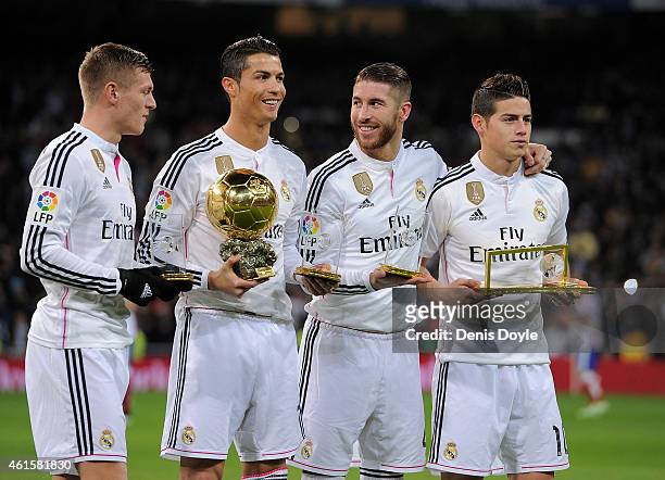 Award winners Toni Kroos, Cristiano Ronaldo, Sergio Ramos and James Rodriguez smile before the Copa del Rey Round of 16, Second leg match between...