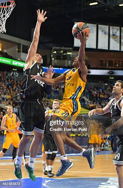 Alex Renfroe of Alba Berlin throws the ball against Gustavo Ayon of Real Madrid\ during the game between Alba Berlin and Real Madrid on January 15,...