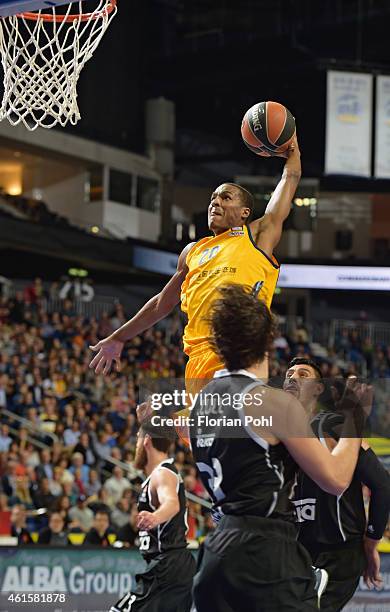 Alex Renfroe of Alba Berlin throws the ball against Gustavo Ayon of Real Madrid during the game between Alba Berlin and Real Madrid on January 15,...
