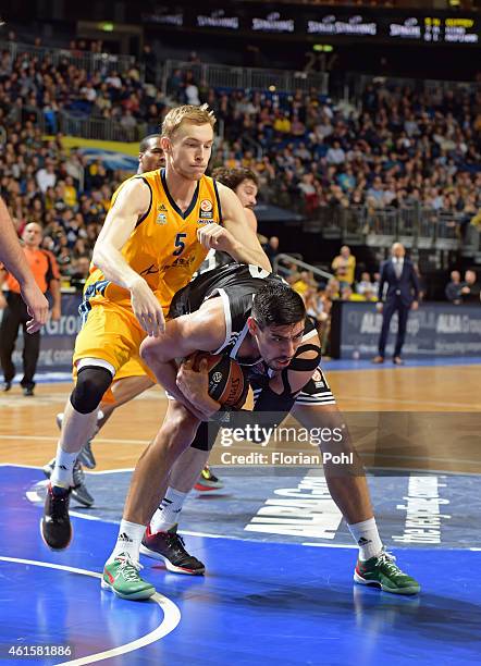 Gustavo Ayon of Real Madrid handles the ball against Niels Giffey of Alba Berlin during the game between Alba Berlin and Real Madrid on January 15,...