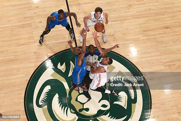 Melvin Ely of the Texas Legends tips the game off against JR Inman of the Delaware 87ers during the 2014 NBA D-League Showcase presented by Samsung...