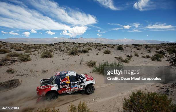 Adam Malysz and Rafal Marton of Poland for Proto Overdrive Toyota compete during Day 5 of the 2014 Dakar Rally on January 9, 2014 in San Jose,...