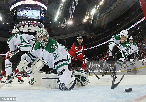 Goaltender Kari Lehtonen and Cody Eakin of the Dallas Stars defend against Reid Boucher of the New Jersey Devils during the second period at the...