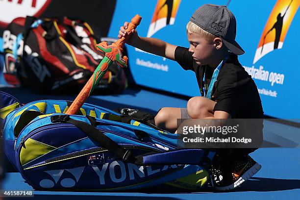 Cruz Hewitt, son of Lleyton Hewitt of Australia, plays with a toy knife during a practice session ahead of the 2015 Australian Open at Melbourne Park...