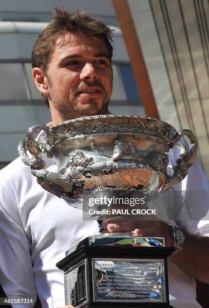 Australian Open Champion 2014, Stan Wawrinka of Switzerland holds the trophy ahead of the official draw for the Australian Open tennis tournament in...