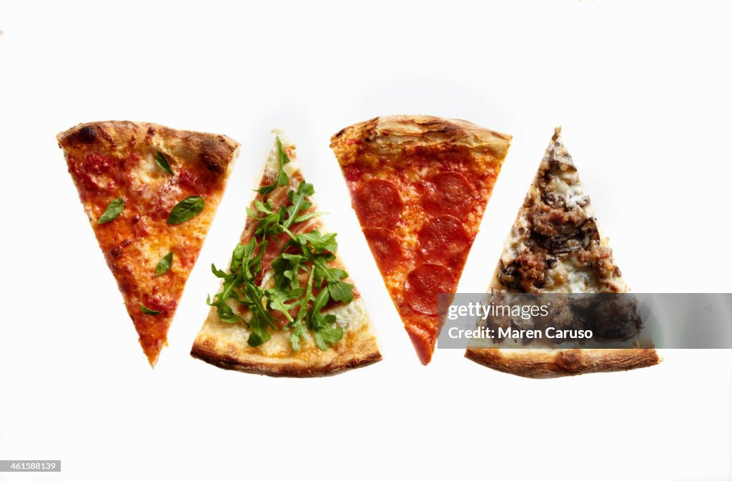 Four Slices of Pizza with Variety of Toppings
