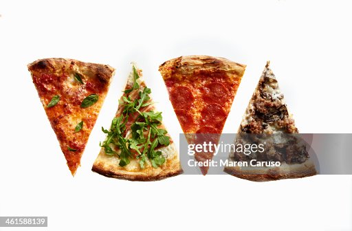 Four Slices of Pizza with Variety of Toppings Four Slices of Pizza with Variety of Toppings