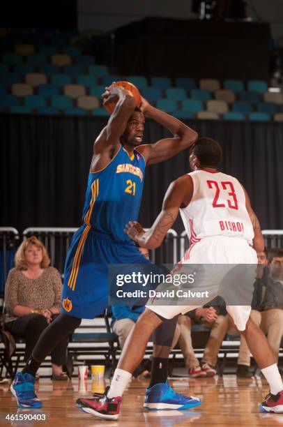 Dewayne Dedmon of the Santa Cruz Warriors looks to pass the ball against Tony Bishop of the Rio Grande Valley Vipers during the 2014 NBA D-League...