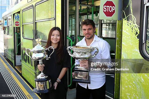 Na Li of China and Stan Wawrinka of Switzerland pose with the Daphne Akhurst Memorial Cup and the Norman Brookes Challenge Cup as they arrive for the...