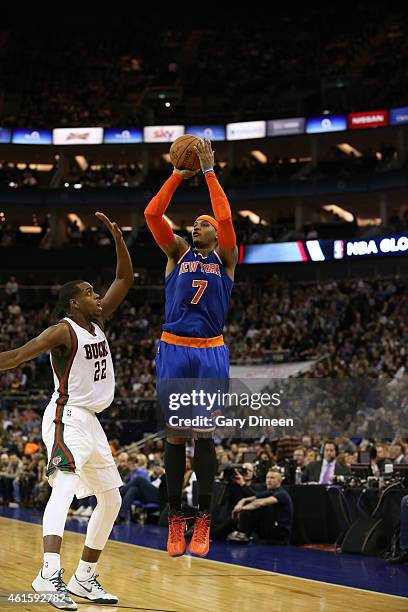 Carmelo Anthony of the New York Knicks shoots against Khris Middleton of the Milwaukee Bucks as part of the 2015 Global Games on January 15, 2015 at...