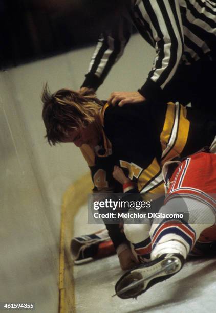Garnet "Ace" Bailey of the Boston Bruins fights with an unidentified New York Rangers player circa 1972 at the Madison Square Garden in New York, New...