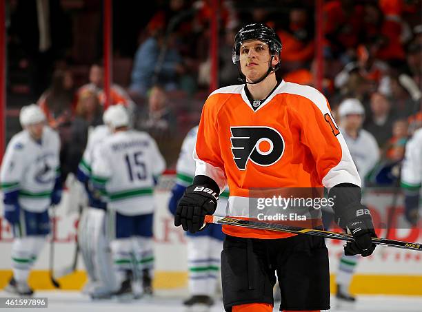 Brayden Schenn of the Philadelphia Flyers reacts to the loss as the Vancouver Canucks celebrate the win on January 15, 2015 at the Wells Fargo Center...