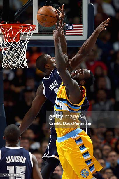 Hickson of the Denver Nuggets lays up a shot against Serge Ibaka of the Oklahoma City Thunder and is fouled by Kendrick Perkins of the Oklahoma City...