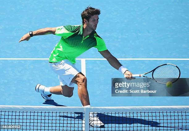 Fernando Verdasco of Spain stretches for the ball during the Championship Match against Alexandr Dolgopolov of Ukraine during day four of the...