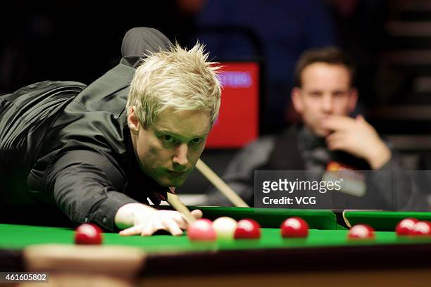 Neil Robertson of Australia plays a shot against Ali Carter of England during day five of the 2015 Dafabet Masters at Alexandra Palace on January 15,...