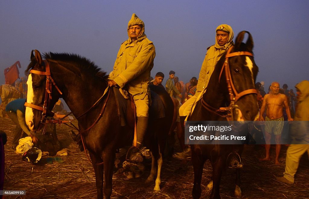 Horse mounted police patrol at Bank of Sangam, confluence of...