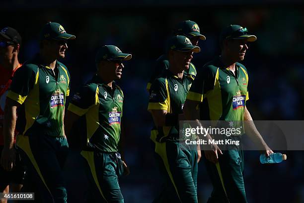 Australian players walk from the field after bowling England out during the One Day International series match between Australia and England at...