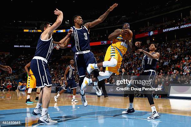 Ty Lawson of the Denver Nuggets lays up a shot and is fouled by Perry Jones of the Oklahoma City Thunder as Nick Collison and Jeremy Lamb of the...