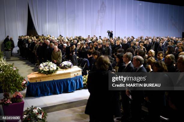 People attend the funeral ceremony of French cartoonist and Charlie Hebdo editor Stephane "Charb" Charbonnier, on January 16, 2015 in Pontoise,...