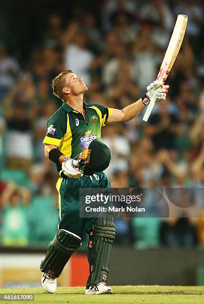 David Warner of Australia celebrates scoring a century during the One Day International series match between Australia and England at Sydney Cricket...