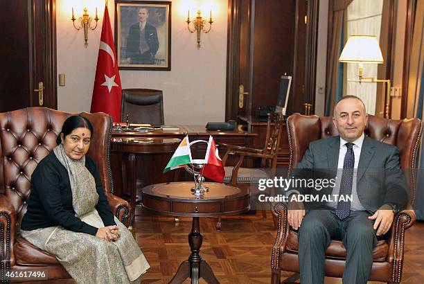 Turkey's Foreign Affairs minister Mevlut Cavusoglu poses with his Indian counterpart Sushma Swaraj prior to a meeting in Ankara, on January 16, 2015....