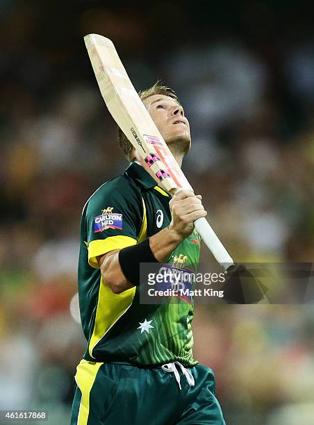 David Warner of Australia looks skyward as he walks from the field after being dismissed during the One Day International series match between...