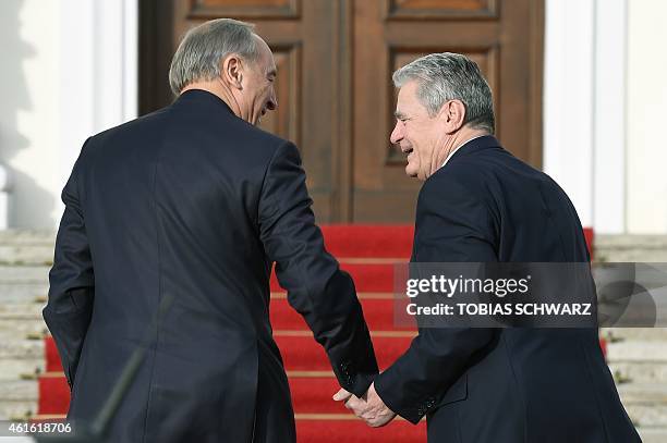 German President Joachim Gauck welcomes his Latvian counterpart Andris Berzins on January 16, 2015 at Bellevue Palace in Berlin. AFP PHOTO / TOBIAS...