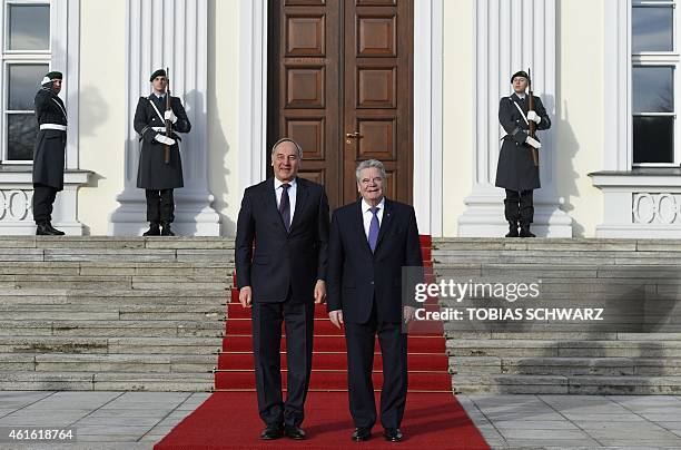 German President Joachim Gauck welcomes his Latvian counterpart Andris Berzins on January 16, 2015 at Bellevue Palace in Berlin. AFP PHOTO / TOBIAS...